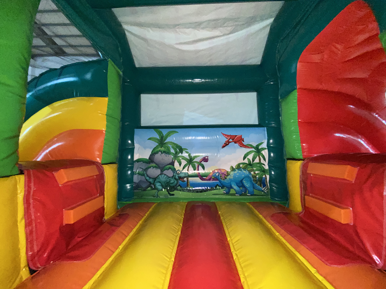 Hüpfburg 6,6x4 - Mega Dino mit 2 Rutschen